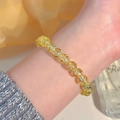 Handcrafted bracelet with radiant yellow crystals and silver beads on a woman's wrist - Bright Yellow Crystal-like Beaded (MY37993)
