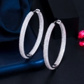 Luxurious large silver-colored hoop earrings with micro-paved sparkling cubic zirconia - White Gold
