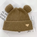 Brown knitted beanie with cute bear ears and a gold heart patch on white background - One Size / Camel