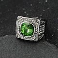 Macro shot of silver signet ring with large green square stone and white pavé crystals - Steel Green Stone