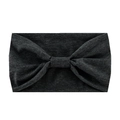 Close-up of a dark grey knitted yoga headband with a decorative bow knot detail - Dark Heather Grey