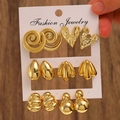 Dettaglio di sei paia di orecchini geometrici dorati con cuori e stelle marine - Oro 14K Elementi (6887)