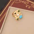 Detailed close-up of a vintage gold ring with pearls and turquoise on a jewelry box - 3# Green Ring