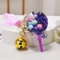 Quicksand lollipop keychain with purple strap, pink beads, and golden bell charm - Snowflake Lollipop [Purple]