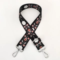Detail of adjustable floral replacement strap with silver hooks and embroidery - Black Ethnic Embroidery / Silver Clasp