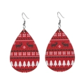 Close-up of teardrop leather earrings with red elk and snowflake Christmas patterns - Red Nordic Elk Snowflake