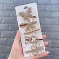 5-piece gold hair clip set with butterfly, bear, and pearls on a display card - Male Butterfly (5 Piece Set)