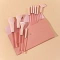 Set of 13 ultra-soft pink makeup brushes with matching leather pouch on beige background - Large Candy Pink / 10 Pcs + Leather Bag