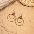 Detail of vintage bohemian earrings with bronze metal rings and brown leather accents - Antique Bronze Double Ring Leather