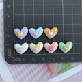 Detailed top view of colorful resin heart charms on a measuring mat for DIY crafts - Double Heart Mixed Colors