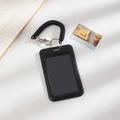 Detail of black plastic ID holder with transparent window and spring coil lanyard - Black Vertical (Without Checkerboard Pendant)