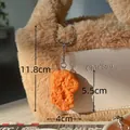 Realistic fried chicken nugget keychain made of textured PVC hanging on a plush bag - Fried Chicken Nugget
