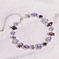 Macro detail of silver bracelet featuring multi-shape purple cubic zirconia stones - Purple Zircon - Silver