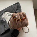 Brown faux fur bucket bag with amber bead handle and long shoulder strap for autumn - Solid Brown