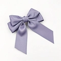 Close-up of a premium purple satin bow hair clip with elegant long double flowing ribbons - Purple