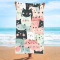 Microfiber beach towel with cartoon cat patterns displayed by a model on the seaside - B67-Cartoon Cats