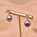 Elegant gold earrings with round mother-of-pearl stud and dangling purple pearl - Purple Pearl Style