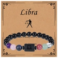 Detail of handmade Libra bracelet with obsidian beads and zodiac symbol card - Libra