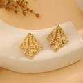 Irregular gold studs with hammered metal texture displayed on a minimalist stand - E6204-32-Wavy Geometric Block