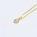 Golden Hamsa Hand necklace with pink opal inlay and minimalist cross chain design - Hamsa Hand / Gold