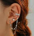 Silver bow and heart earring set with double pearl chains shown on female model - Bow Heart Pearl Silver