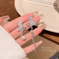 Detail of silver butterfly earrings with a white pearl and long tassel drop accents - A1623 Silver