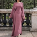 Elegant solid mauve long sleeve linen maxi dress worn by a model in an outdoor setting - S / Pink