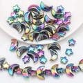 Close-up of iridescent moon and star glass beads for DIY jewelry making accessories - Multicolor