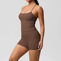 Detail of high-stretch brown yoga set with side pockets on high-waisted gym shorts - S / Chestnut Brown