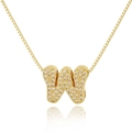Close-up of golden letter W pendant with white zircon stones on a box chain - Letter W