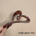 Elegant tortoiseshell claw clip featuring a heart-shaped twist design and 12cm length - Glossy Heart Tortoise-12cm
