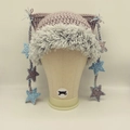 Detail view of handmade cat ear beanie with star charms and fluffy faux fur trim - Dusty Rose Cat Ears