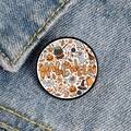 Close-up of Halloween badge with pumpkin and ghost motifs on blue denim fabric - Cartoon Halloween Graffiti Elements Style (XZ6939)