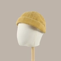 Mustard yellow vintage docker hat featuring a washed cotton texture and rolled edge - Yellow