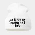 Detail of white knit beanie showing black letter embroidery put it on my husband's tab - White