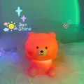 Cute battery-operated cartoon bear night light with warm orange glow for kids' bedroom - Strawberry Bear