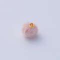 Detailed view of a soft pink faux mink fur pompom pendant with a golden metal ring loop - 16*19mm / Light Pink Fur Ball