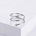 Minimalist silver spiral ring with sparkling zircons on a white geometric block - US 6 / Steel