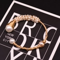 Handcrafted gold wire-wrapped bracelet with baroque pearls and small white beads - Gold Multi-Bead Woven Style