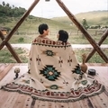 Detailed close-up of tribal geometric jacquard pattern and fringe edge on a camping blanket - Sucre Beige / 90x90cm