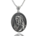 Macro shot of a punk vintage silver stainless steel portrait pendant on white background - Saint Relief