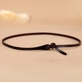 Minimalist dark brown leather skinny belt for women featuring a stylish knotted design - Coffee