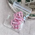 Set of two pink sequin heart hair clips with glitter finish on a light pink metal base - Pink Heart