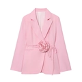 Detailed view of 3D rose decoration and waist tie on a pink women's blazer jacket - S / Pink