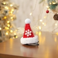 Mini red Christmas hat hair clip with golden wings and white snowflake on a wooden desk - Shiny Velvet Wings