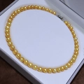 Classic round golden freshwater pearl necklace with silver clasp in a velvet jewelry box - Gold
