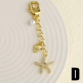 Llavero dorado variante D con colgante de estrella de mar, concha y perla - Estilo D - Estrella de Mar Diamantes de Imitación