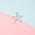 Macro shot of silver starfish pendant with dot texture on a bicolor background - Dotted Starfish Style (2#)