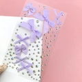 Detail of purple ribbon bows and iridescent rhinestones for makeup face decoration - BJA-638 (Purple Bow Tie)