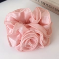Close-up of pink rose flower scrunchie with layered organza petals and delicate textures - Pink